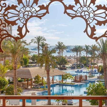 Grand Palace - Couples Only 18 Years Plus (Adults Only) フルガダ エクステリア 写真 View of the pool at the Hilton Sharm El Sheikh